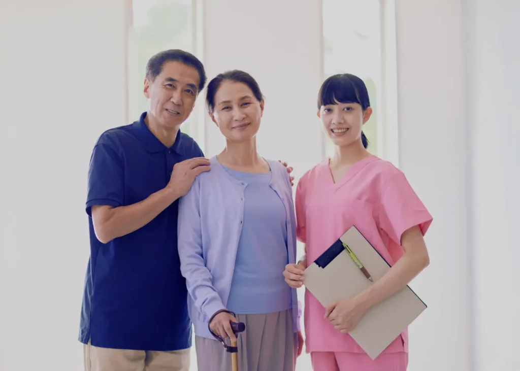 Sick women on her Medicaid Coverage, standing with nurse and family